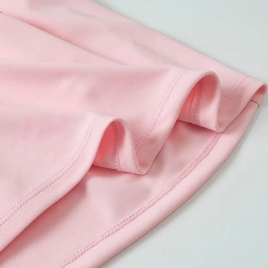Detailed macro view of pink fabric texture and durable double-needle stitching on the hem