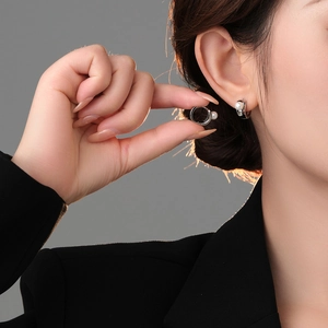 Elegant silver pearl hoop earrings for women featuring minimalist polished metal design