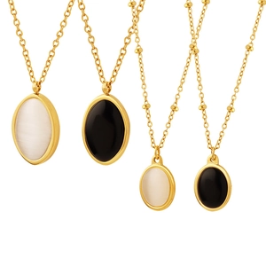 Vintage cat eye stone and black onyx pendants on gold titanium steel necklaces