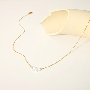 Elegant 18k gold plated necklace with a white pearl bow pendant for women