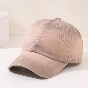 Close-up of khaki baseball cap with vintage distressed embroidery and breathable vents