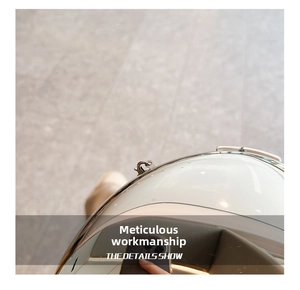 Macro shot of silver lobster clasp on a white high-gloss acrylic crossbody evening bag
