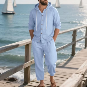 Detail of light blue linen blend beach set featuring a hooded long sleeve shirt and pants