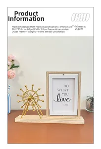 Detail showing the rotating wooden 4x6 picture frame with a gold Ferris wheel model