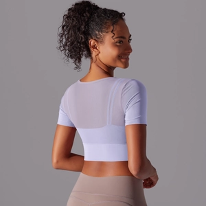 Lavender purple yoga crop top featuring breathable mesh splicing and short sleeves