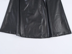 Detailed close-up showing the crocodile embossed texture on a black PU leather trench coat