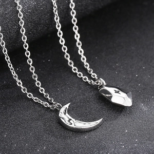 Irregular textured moon and crystal star pendant necklaces in silver finish