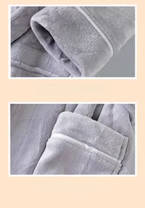 Detail of cuff binding and fine stitching on a thick coral fleece bathrobe set