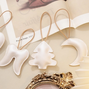 Chic cream white leather Christmas tree ornaments and wing shaped bag accessories