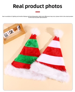 Close-up of red and green striped plush elf hats with white faux fur and pom-poms
