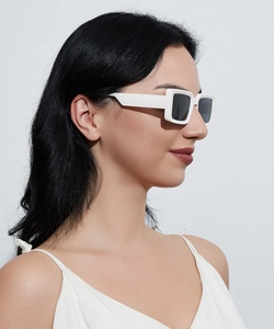 Side view of stylish white square frame sunglasses on model for a trendy ins look