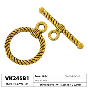 Detailed macro view of vintage gold brass OT toggle clasp with spiral texture for jewelry