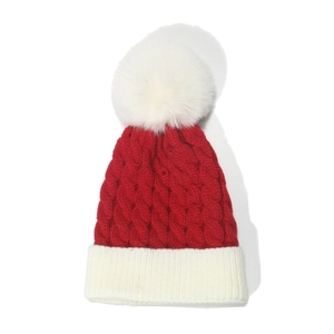 Kids red and white cable knit Christmas beanie with large faux fur pompom on top