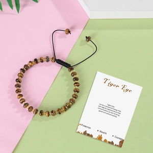 Bohemian adjustable tiger eye stone woven bracelet with meaning card on colorful background