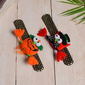 Detail of Halloween sequin slap bracelets with pumpkin and monster hat designs