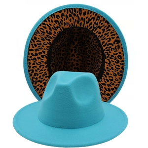 Detail of teal fedora showing the wide brim and leopard print lining on the underside