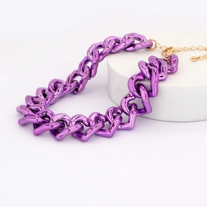 Detail of purple metallic heart chain pet necklace on white display stand with gold clasp