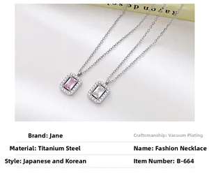 Detail of square zircon halo pendants in pink and clear on titanium steel necklaces