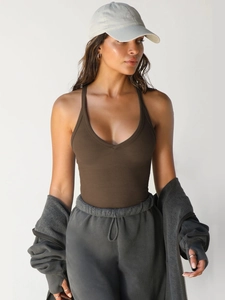 Detail view of dark brown ribbed slim-fit crop top with athletic streetwear styling