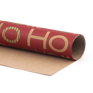 Christmas kraft paper roll with red surface and green Ho Ho Ho text print for gift wrapping