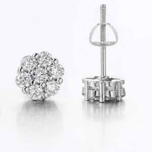 Detailed view of silver flower stud earrings with pavé stones and screw back closure