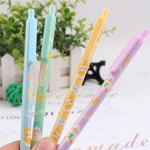 Close-up of hand holding four colorful cartoon duck mechanical pencils in blue and yellow