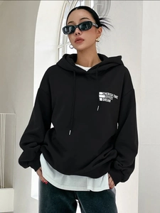 Women's black oversized hoodie with retro street style print and drop shoulder design