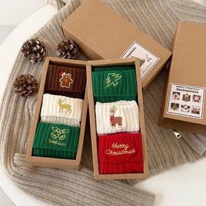 Christmas themed cotton crew socks set with holiday embroidery in a gift box packaging