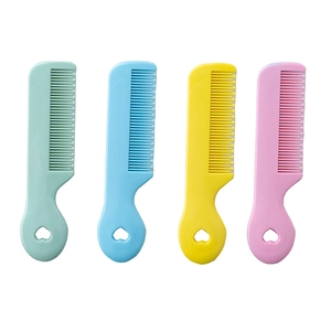 Set of four colorful plastic baby hair combs with heart-shaped cutouts on handles