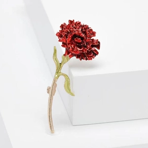Artistic zinc alloy red carnation flower brooch with green leaves on white pedestal