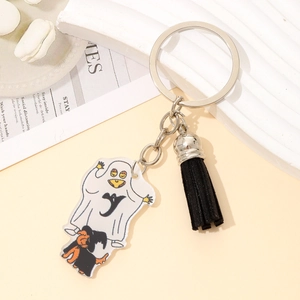Halloween ghost and black dog acrylic keychain with tassel charm on a display tray