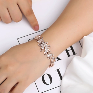 Detailed view of rose gold floral bracelet with marquise-cut cubic zirconia crystals