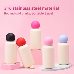 Detail of 316 stainless steel vacuum flask with colorful lids on pink display stands