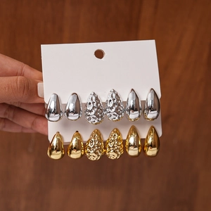 Set of 12 teardrop stud earrings in gold and silver finish with smooth and hammered textures