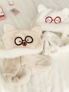 Close-up of thick plush hooded scarf with bear and chick designs and embroidered glasses