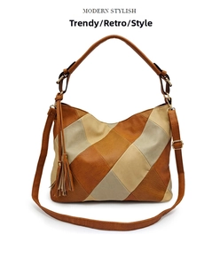 Detail of retro color-block handbag with long tassels and adjustable shoulder strap