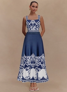 Front detail of navy and white ethnic floral print dress with square neckline and A-line hem