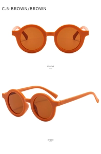 Front and 45-degree side view of matte brown round frame sunglasses for babies