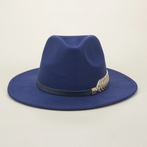 Close-up of navy blue felt fedora with a gold metallic leaf on a black leather band