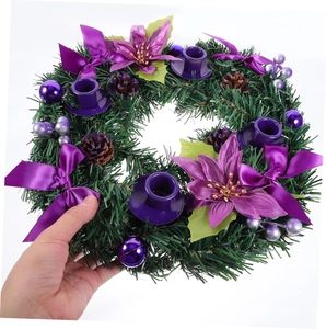 Christmas wreath with purple silk flowers, pine cones and four candle holders on white background