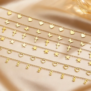 Golden stainless steel layered necklaces featuring heart, butterfly and star pendants