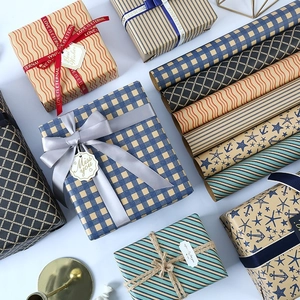 Eco-friendly kraft gift wrapping paper set with grid patterns and decorative ribbons