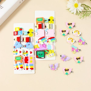 Cartoon school supplies and fairy-themed hair clips set for girls on beige background