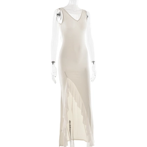 Detail of white V-neck dress featuring a high side slit and elegant ruffle trim design