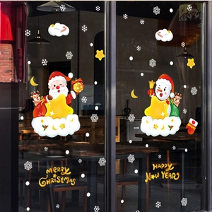 Christmas window stickers with Santa, snowman and snowflakes on glass for festive decor