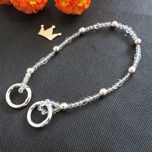 Detail of DIY crystal acrylic bead strap with silver metal links and round spring clasps