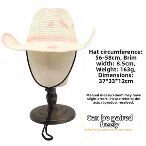 Detail of straw cowboy hat with pink stars, adjustable cord, and 56-58cm brim size