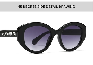 Close-up of 45-degree side detail on oval sunglasses with crystal-encrusted temples