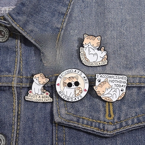 Set of 5 cartoon cat enamel pins on denim jacket with cute funny meow letterings