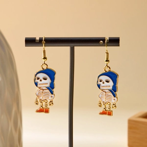 Fashionable Halloween skull earrings with blue hood and orange shoes on black display stand